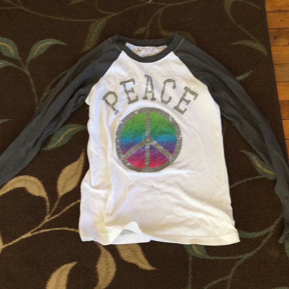 A peace sign shirt long sleeve shirt